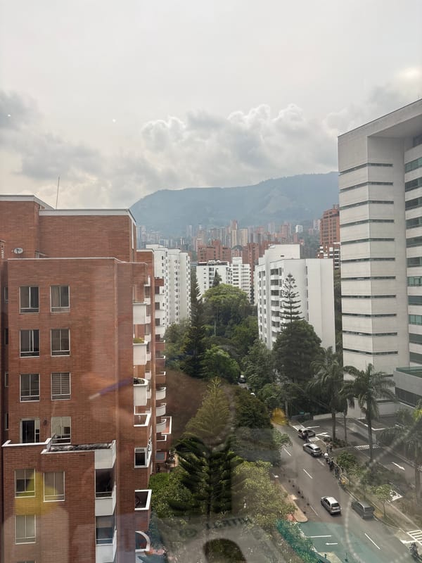 Panoramic city view captured from window in Medellín