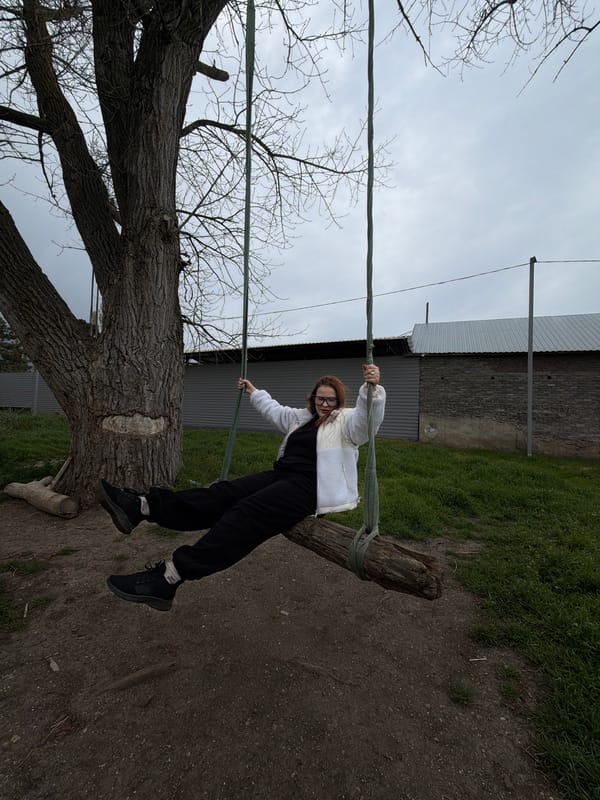 Woman enjoys homemade tree swing in Port-Katon, Russia