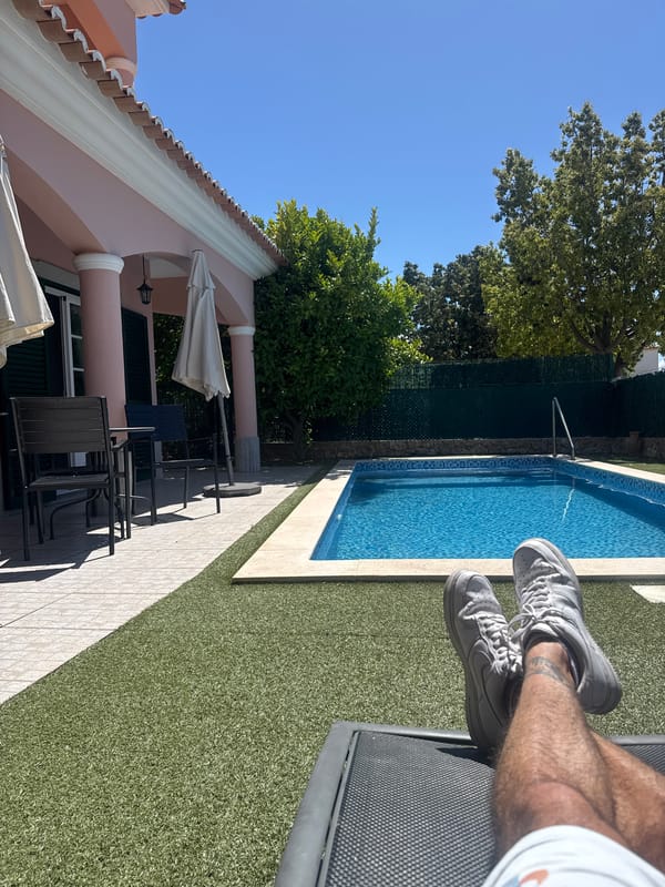 Swimming pool area with pink building observed Tuesday morning