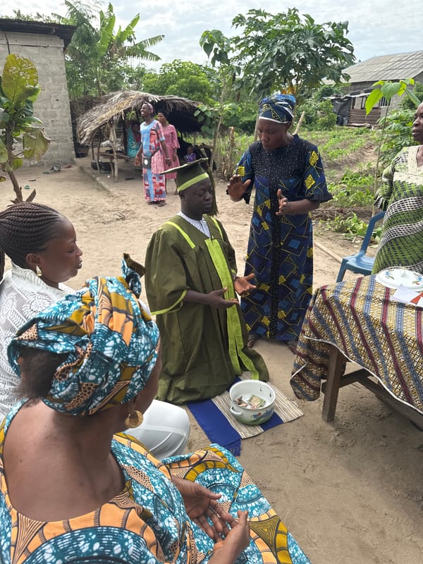 Outdoor ceremony with graduation attire observed in Tofa, Nigeria