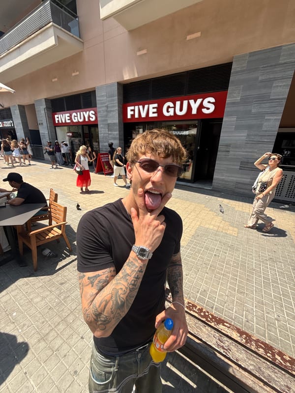 Playful pose with a drink, Barcelona midday