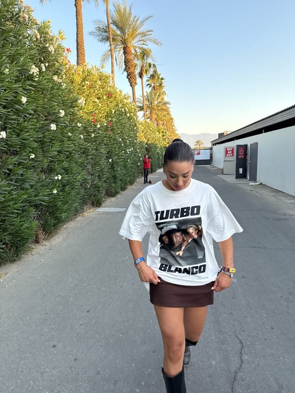 Woman in Turbo Blanco shirt spotted at Indio festival