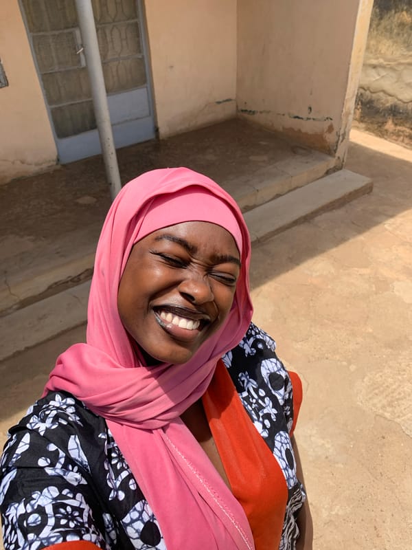 Woman in pink hijab photographed in Rafin Par, Nigeria