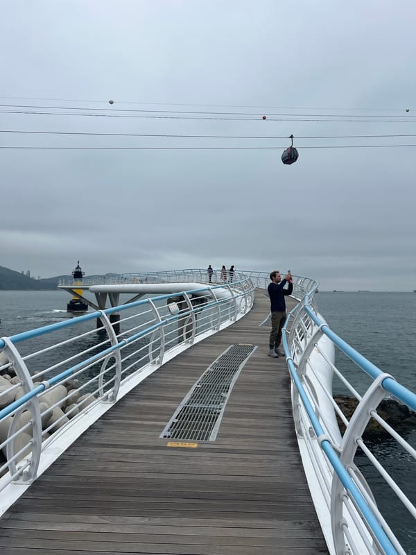 Tourist documents early morning coastal sightseeing tour in Busan