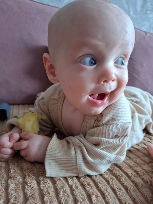 Baby photographed indoors in Karsha, Russia