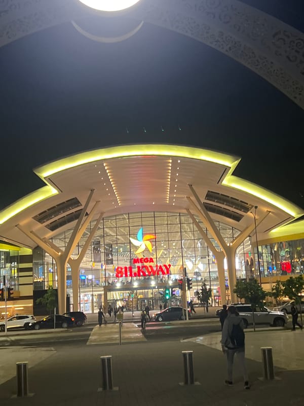 Mega Silk Way mall illuminated at night in Astana