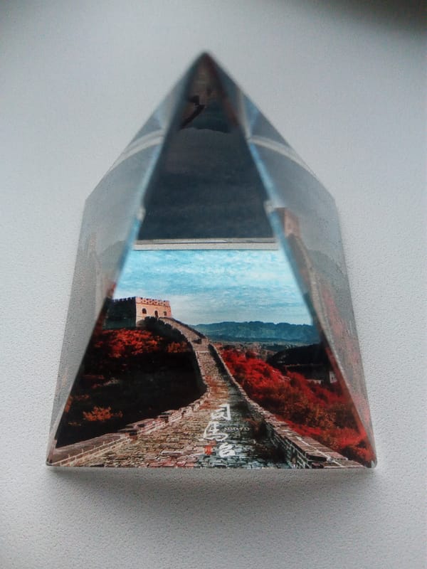Great Wall souvenir prisms and a glowing gaming setup in Usman