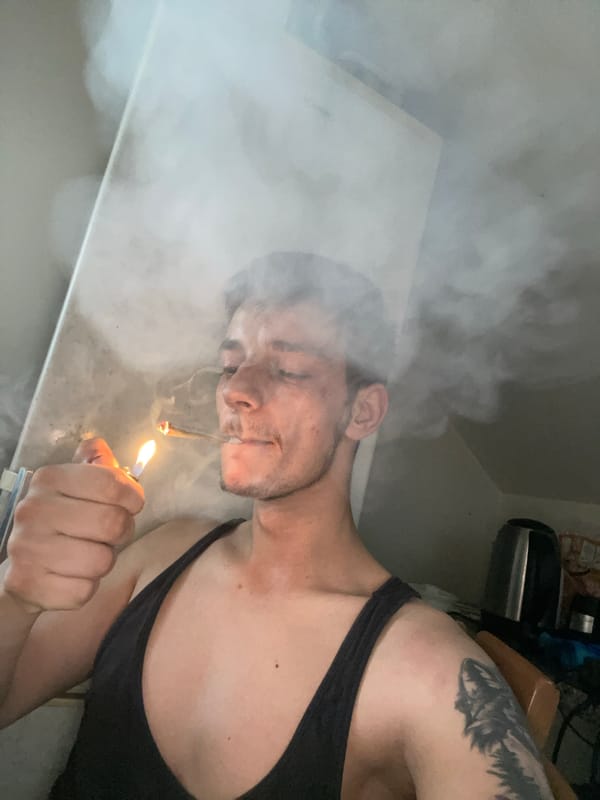Rolling and smoking a joint, close-up angles