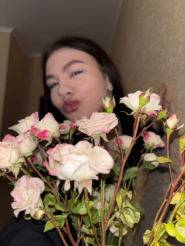 Woman photographed with rose bouquet in Perm, Russia