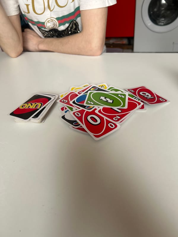 Child plays Uno cards in Tsarevo home