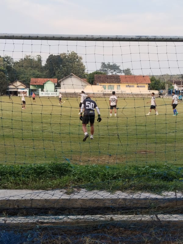 Soccer training session observed at Indonesian elementary school field