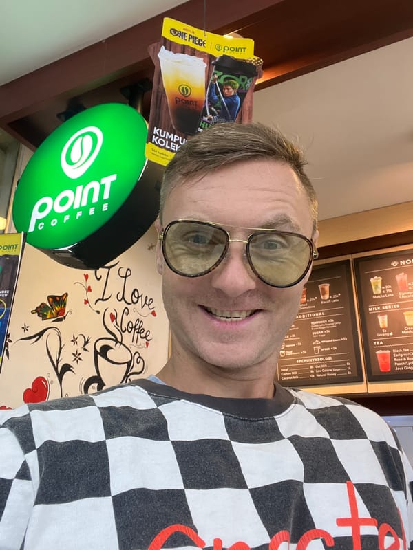 Tourist takes selfies at coffee shop in Sukawati