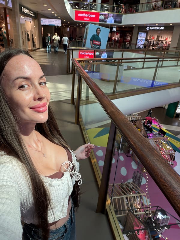 Inside a busy Saint Petersburg shopping mall on a summer afternoon