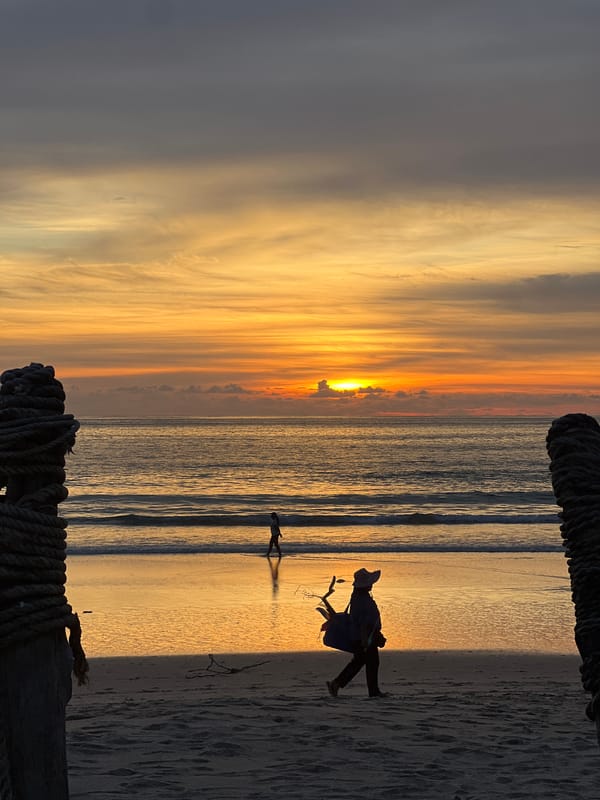 Sunset beach scene with horseback riding and ocean views