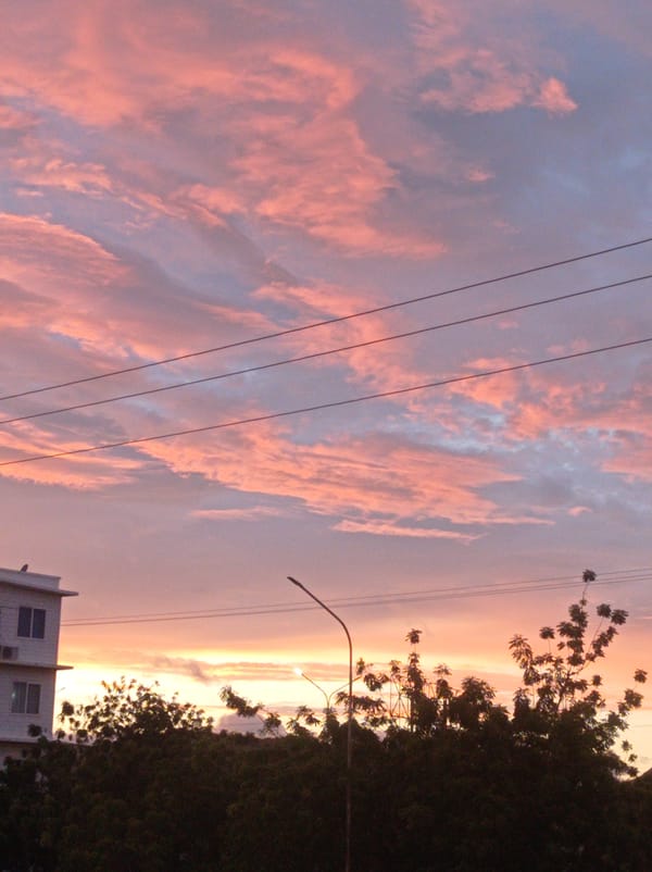 Colorful sunset over Porlamar's urban skyline
