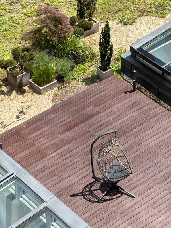 Rooftop terrace with wooden deck observed in Sofia