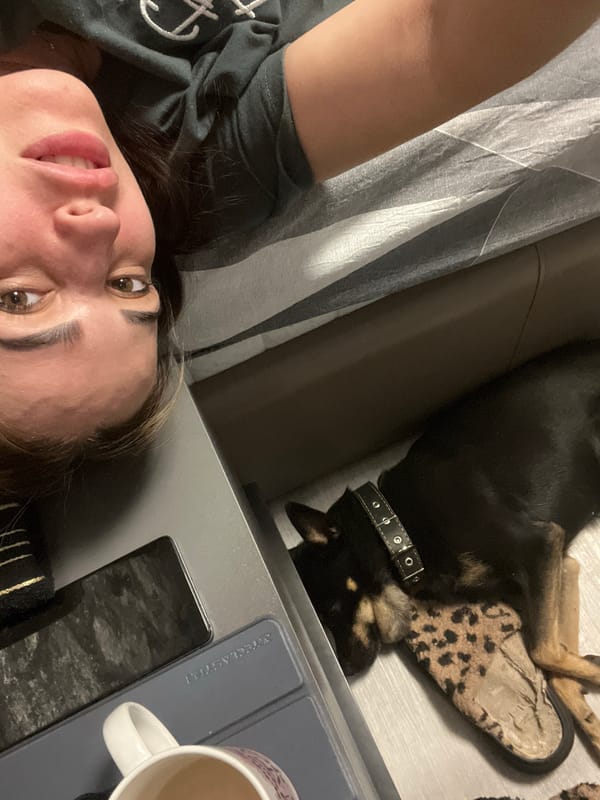 Family and dog share quiet bedroom moment together