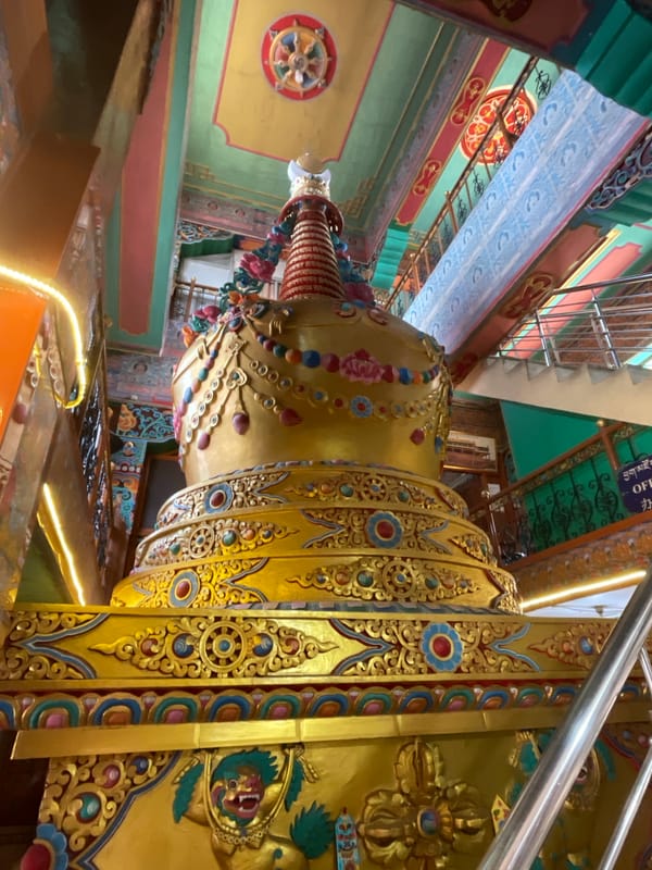Visitor captures ornate gold temple details in Dharamshala