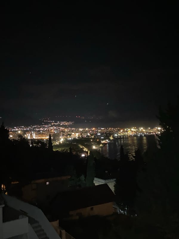 Nighttime coastal lights captured in Šušanj, Montenegro