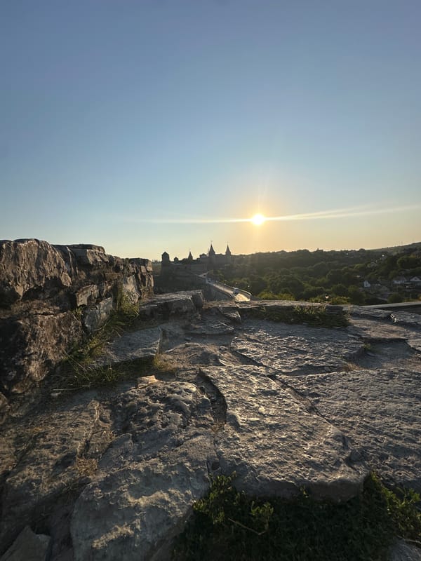 Kamianets-Podilskyi Castle glowing at sunset from every angle