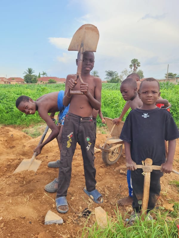 Young boys perform manual labor in Bukuru Nigeria
