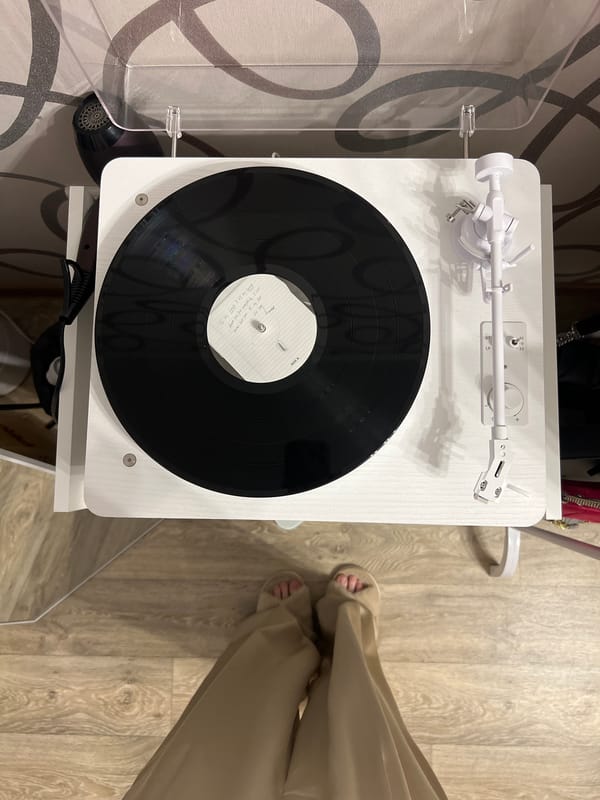Woman documents vinyl listening session with selfies in Kazan