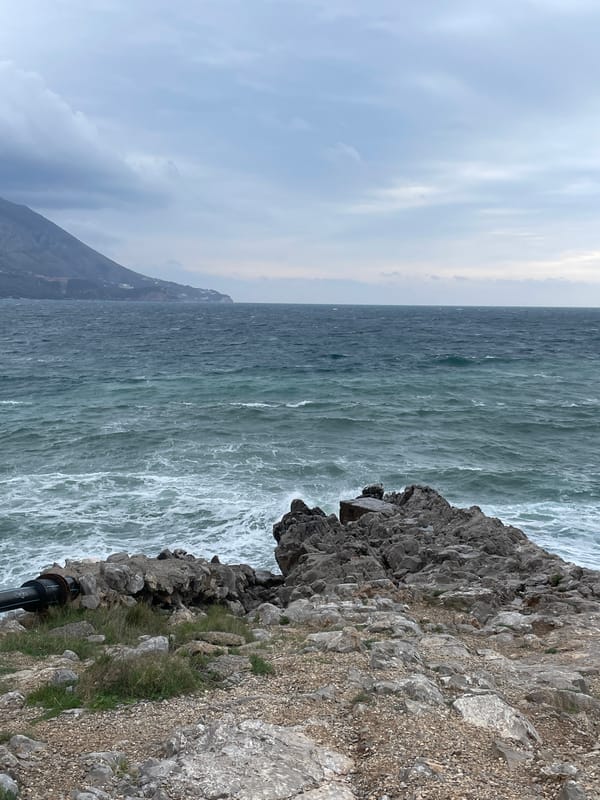 Visitor documents stormy coastal scenery in Budva, Montenegro