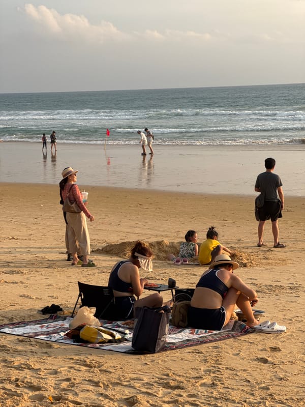 Karon Beach buzzing through a golden-hour afternoon