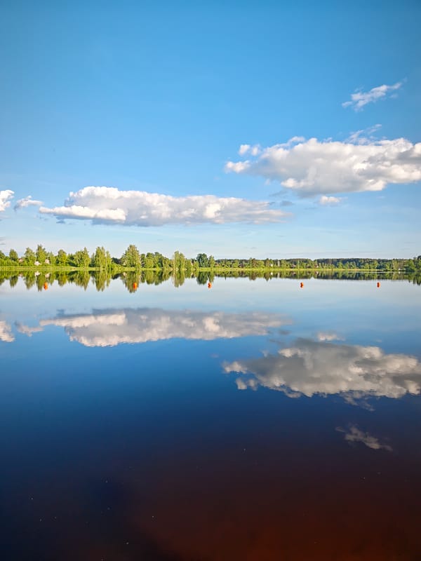 Woman visits waterside park in Zaprudnya during golden hour