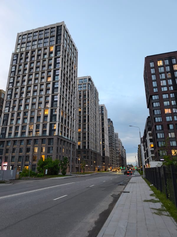 Purple tracksuit wearer documents Moscow streets in evening walkabout