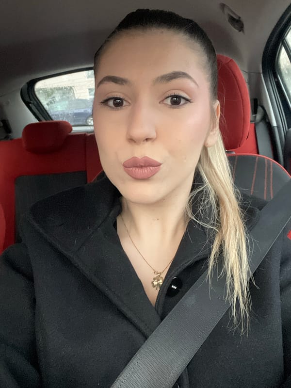 Woman takes selfie in parked car in Burgas, Bulgaria