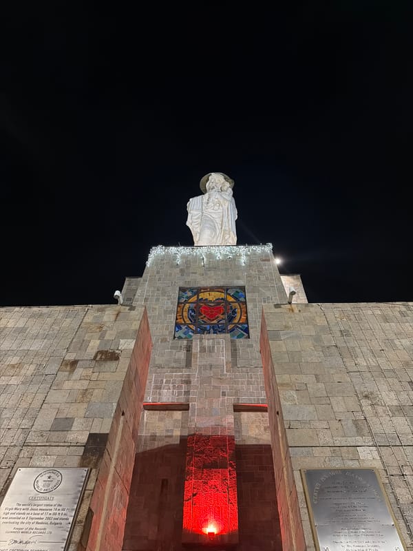 Nighttime documentation of illuminated Virgin Mary monument in Haskovo, Bulgaria