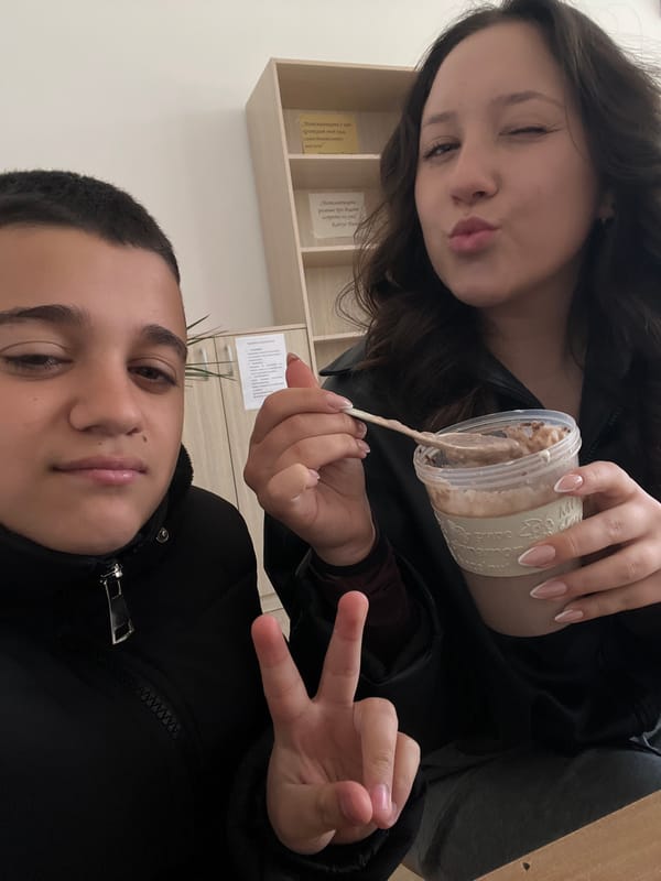 Two people share morning beverages in Karnobat, Bulgaria