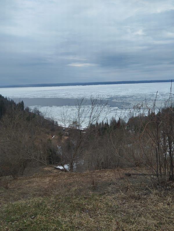 Woman photographed at ice-covered water viewpoint in Галево, Russia