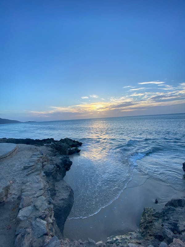 Evening life captured in Juan Griego: sunset views, youth soccer