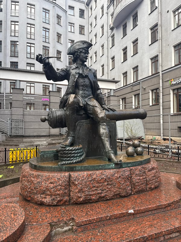 Bronze naval statue with torch observed in Saint Petersburg