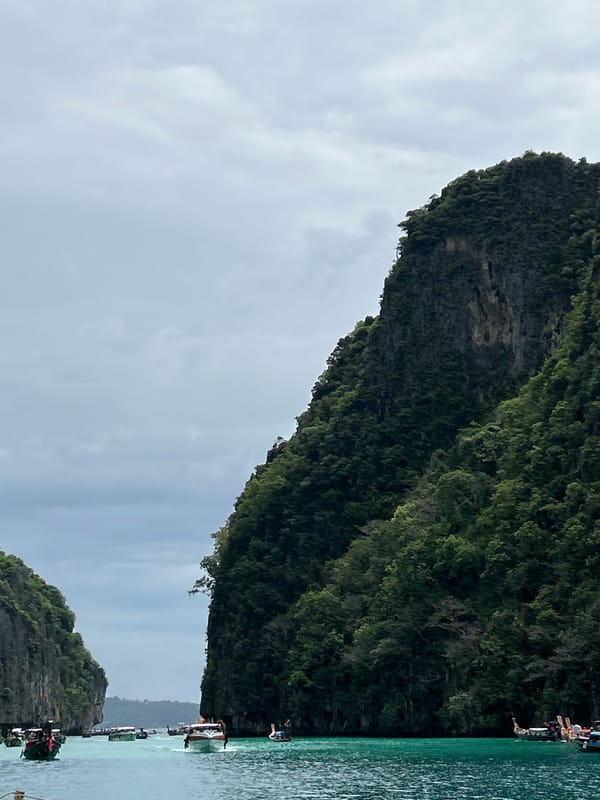 Limestone karsts photographed in Thai tropical bay during overcast morning