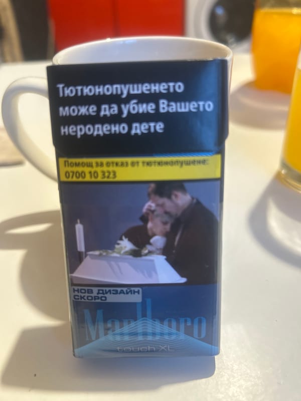 Cigarette pack attached to mug in Bulgarian coastal town