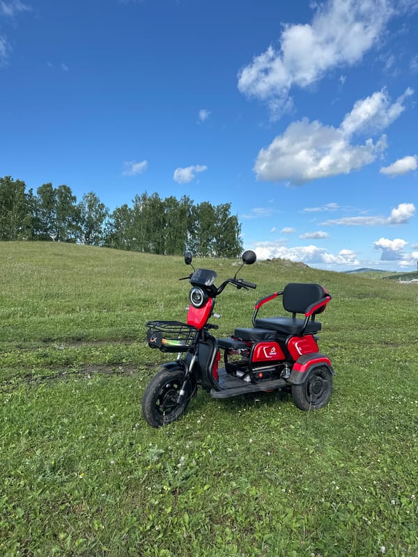Young rider explores countryside on motorcycle during sunny afternoon