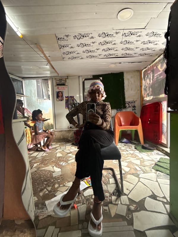 Mirror selfie moment in Ado, Nigeria, leopard print and phone in hand