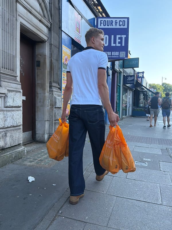 Sainsbury's run through a London street, mid-evening