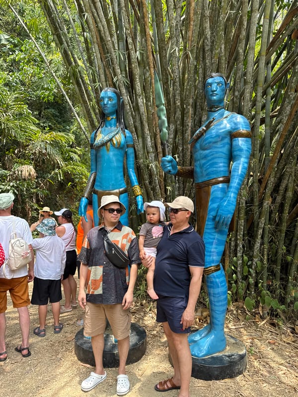 Tourists pose with Avatar statues in Thai village