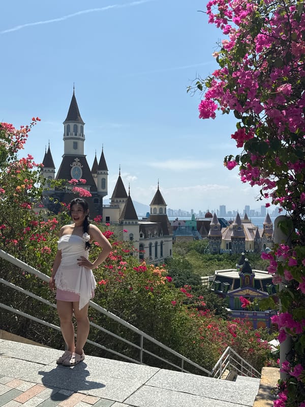 Woman poses for photos amid bougainvillea flowers in Nha Trang
