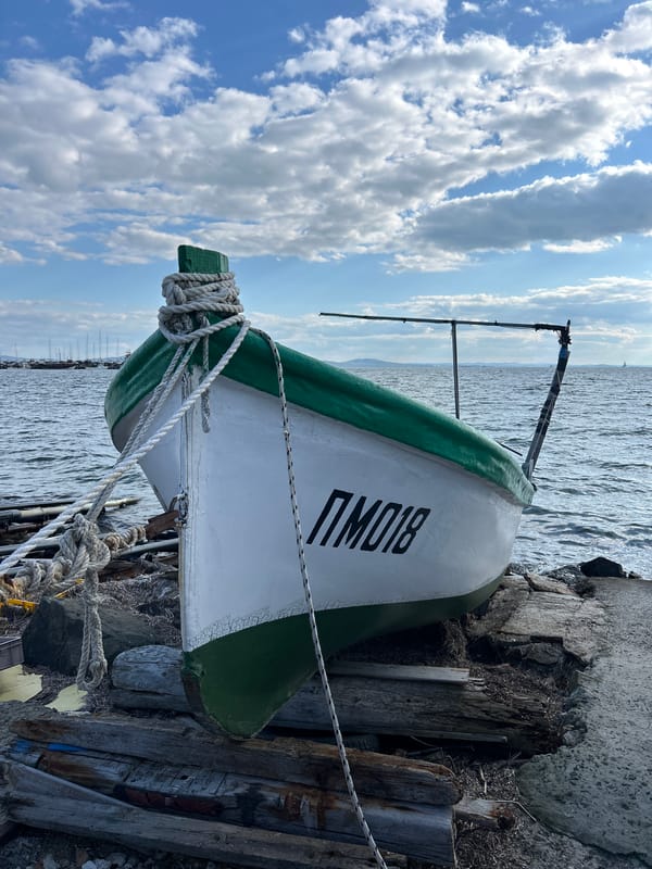 Fishing boat docked along Pomorie waterfront promenade