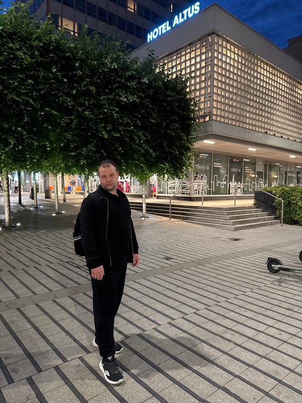 Evening stroll documented across central Poznan commercial district