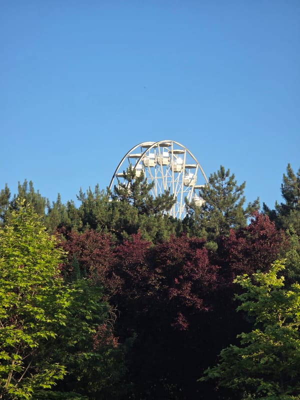 Family afternoon at Herăstrău Park's amusement area in Bucharest