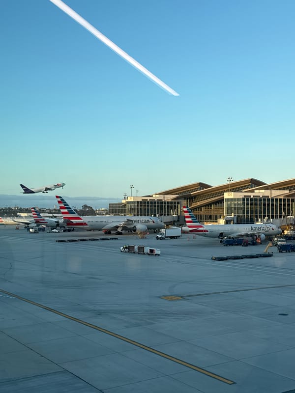 Woman makes peace sign at LAX airport terminal