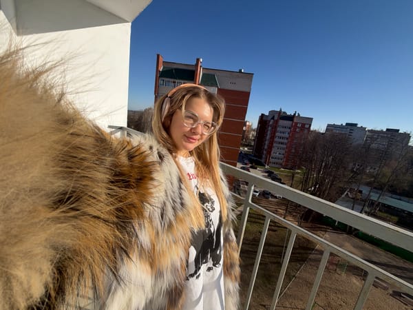 Woman photographed on balcony during early morning in Chaikovsky