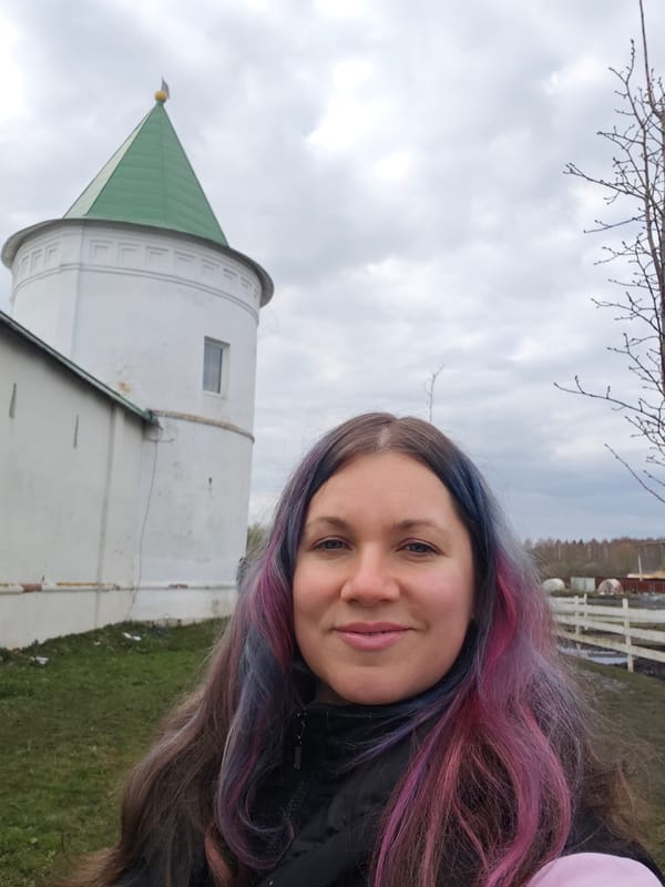 Visitor documents animals and architecture at Russian monastery site
