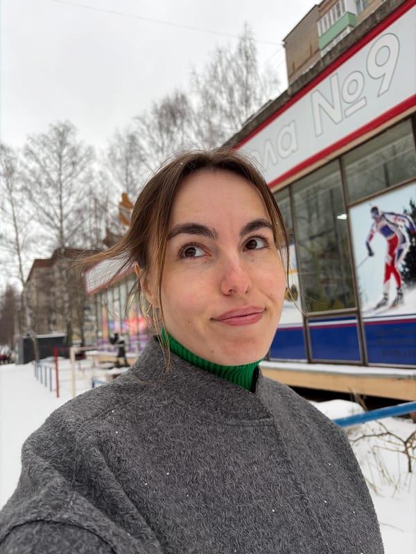Woman poses for selfie near skating monument in Izhevsk